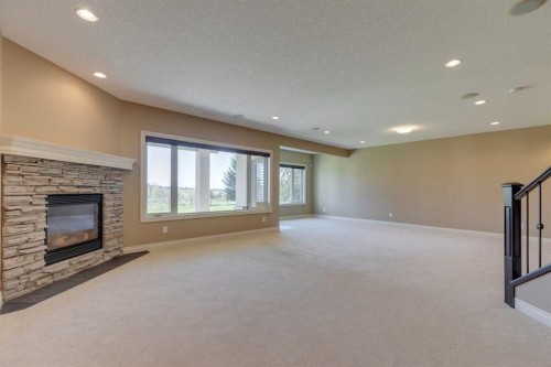 144 Tuscany Ravine Heights Nw, Calgary, AB - Indoor With Fireplace