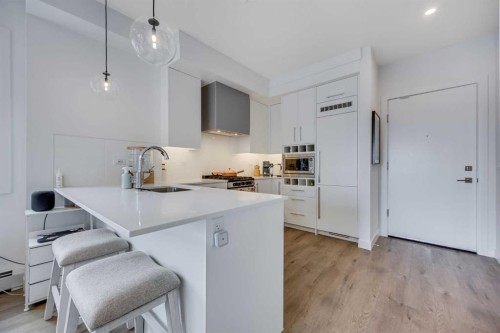 402-8230 Broadcast Avenue, Calgary, AB - Indoor Photo Showing Kitchen With Upgraded Kitchen
