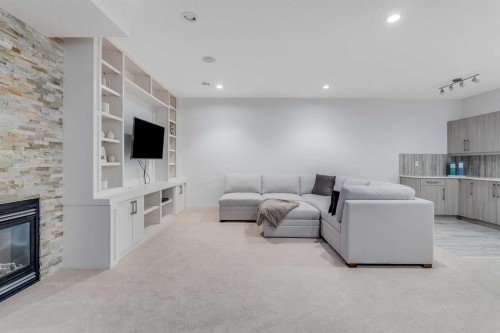 434 30 Avenue Nw, Calgary, AB - Indoor Photo Showing Other Room With Fireplace