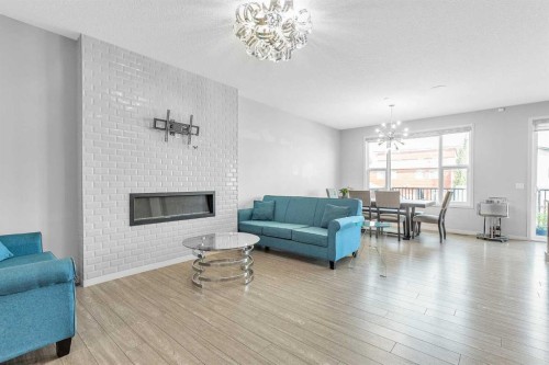 69 Howse Common Ne, Calgary, AB - Indoor Photo Showing Living Room With Fireplace