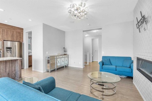 69 Howse Common Ne, Calgary, AB - Indoor Photo Showing Living Room