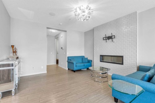 69 Howse Common Ne, Calgary, AB - Indoor Photo Showing Living Room With Fireplace