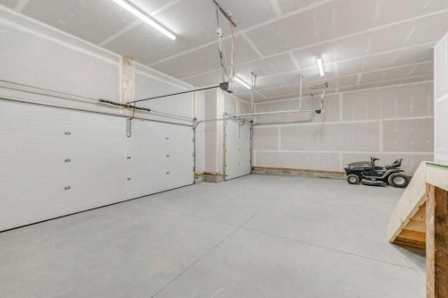 7 Clover Crescent, Beiseker, AB - Indoor Photo Showing Garage