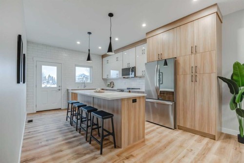 7 Clover Crescent, Beiseker, AB - Indoor Photo Showing Kitchen With Upgraded Kitchen