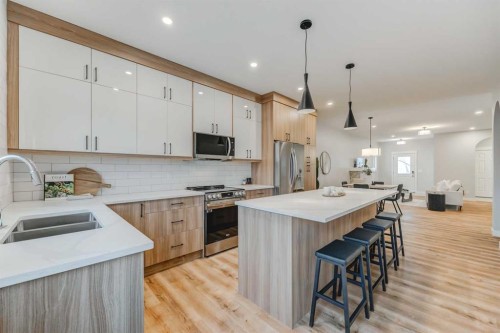 7 Clover Crescent, Beiseker, AB - Indoor Photo Showing Kitchen With Stainless Steel Kitchen With Double Sink With Upgraded Kitchen