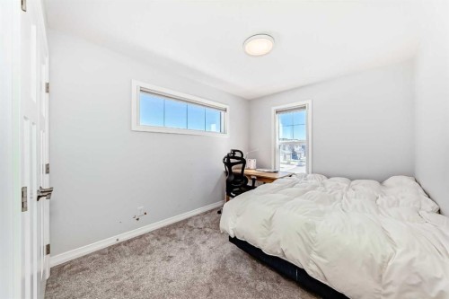 108 Magnolia Way Se, Calgary, AB - Indoor Photo Showing Bedroom