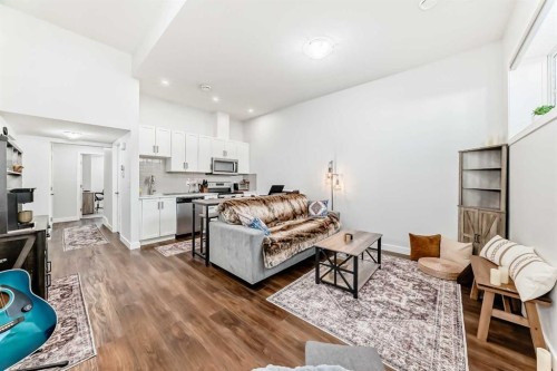 108 Magnolia Way Se, Calgary, AB - Indoor Photo Showing Living Room