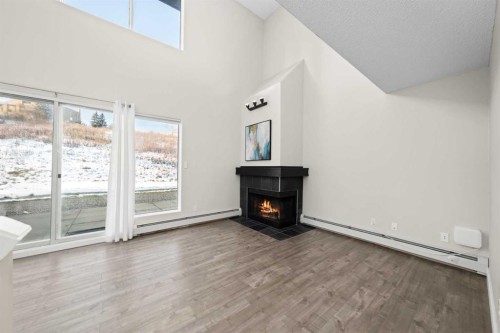 8-301 Village Mews Sw, Calgary, AB - Indoor With Fireplace