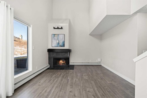 8-301 Village Mews Sw, Calgary, AB - Indoor With Fireplace
