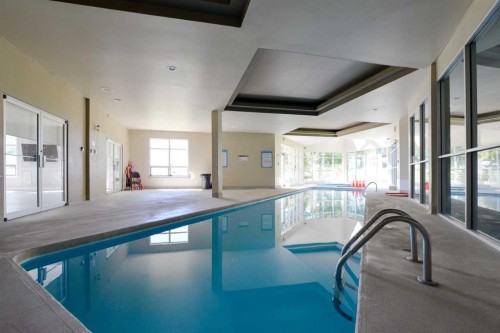 8-301 Village Mews Sw, Calgary, AB - Indoor Photo Showing Other Room With In Ground Pool