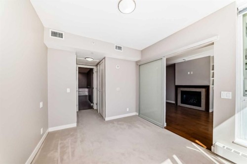 521-222 Riverfront Avenue Sw, Calgary, AB - Indoor Photo Showing Other Room With Fireplace