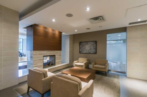 521-222 Riverfront Avenue Sw, Calgary, AB - Indoor With Fireplace