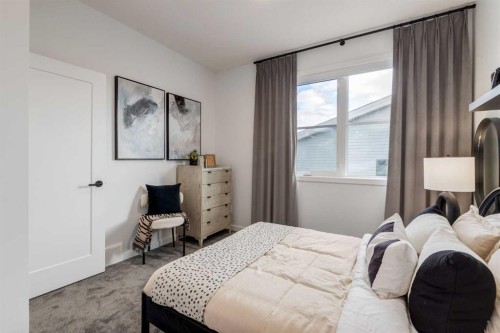 410-1453 Na'A Drive Sw, Calgary, AB - Indoor Photo Showing Bedroom