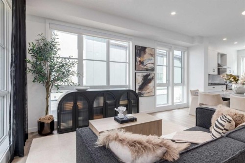 410-1453 Na'A Drive Sw, Calgary, AB - Indoor Photo Showing Living Room