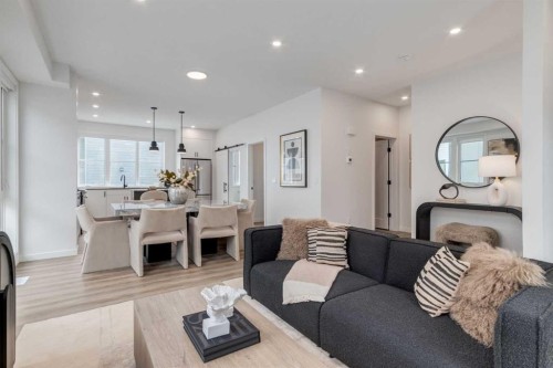 410-1453 Na'A Drive Sw, Calgary, AB - Indoor Photo Showing Living Room