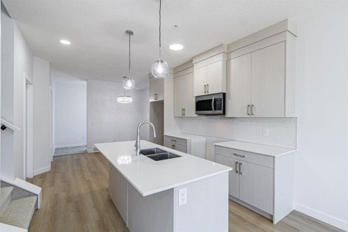 1463 Cornerstone Boulevard Ne, Calgary, AB - Indoor Photo Showing Kitchen With Double Sink With Upgraded Kitchen