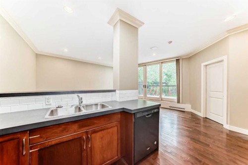 101-323 13 Avenue Sw, Calgary, AB - Indoor Photo Showing Kitchen With Double Sink