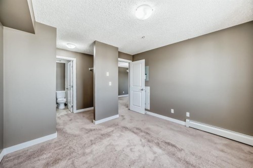 302-15 Saddlestone Way Ne, Calgary, AB - Indoor Photo Showing Other Room