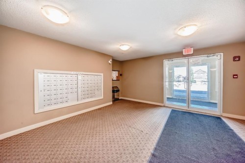 302-15 Saddlestone Way Ne, Calgary, AB - Indoor Photo Showing Other Room