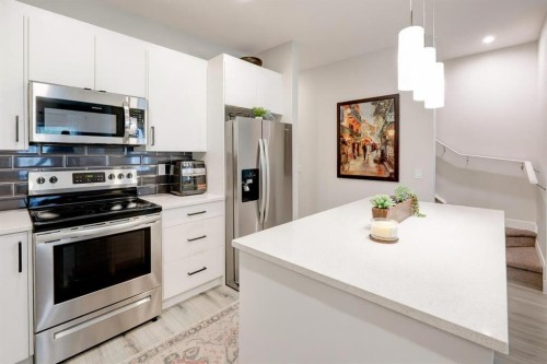 561 Canals Crossing Sw, Airdrie, AB - Indoor Photo Showing Kitchen With Upgraded Kitchen