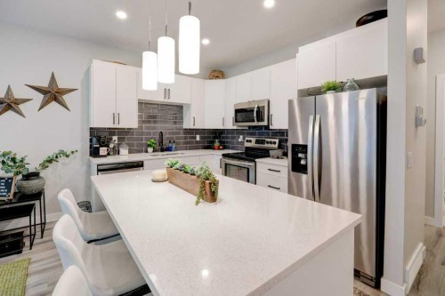 561 Canals Crossing Sw, Airdrie, AB - Indoor Photo Showing Kitchen With Upgraded Kitchen