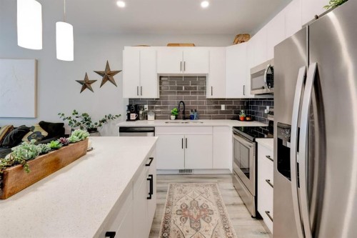 561 Canals Crossing Sw, Airdrie, AB - Indoor Photo Showing Kitchen With Upgraded Kitchen