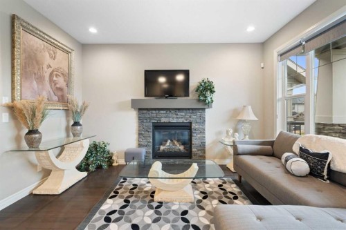 393 Nolanfield Way Nw, Calgary, AB - Indoor Photo Showing Living Room With Fireplace