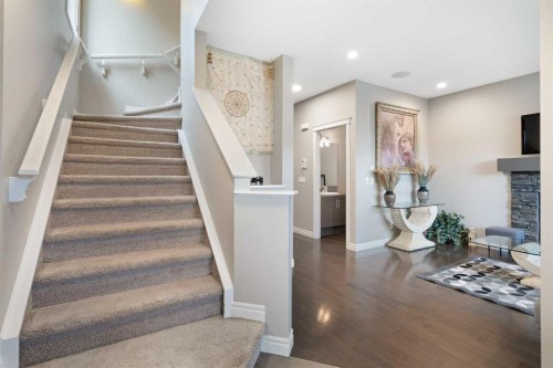 393 Nolanfield Way Nw, Calgary, AB - Indoor Photo Showing Other Room With Fireplace