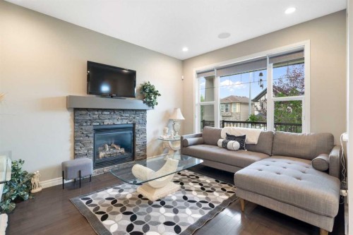 393 Nolanfield Way Nw, Calgary, AB - Indoor Photo Showing Living Room With Fireplace