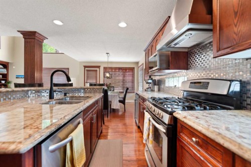 182 Sienna Park Drive Sw, Calgary, AB - Indoor Photo Showing Kitchen With Double Sink With Upgraded Kitchen