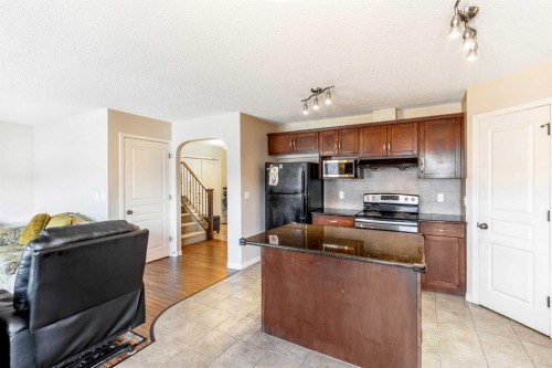 15 Kingsland Way Se, Airdrie, AB - Indoor Photo Showing Kitchen