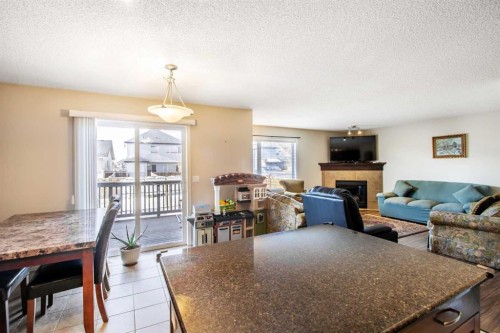 15 Kingsland Way Se, Airdrie, AB - Indoor With Fireplace