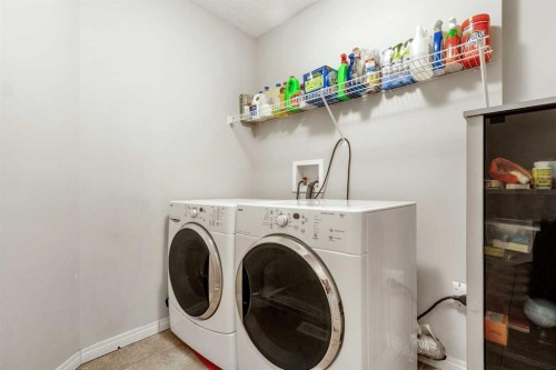 15 Kingsland Way Se, Airdrie, AB - Indoor Photo Showing Laundry Room