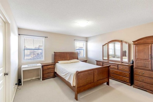 15 Kingsland Way Se, Airdrie, AB - Indoor Photo Showing Bedroom