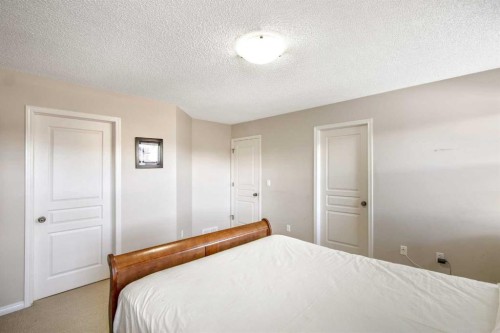 15 Kingsland Way Se, Airdrie, AB - Indoor Photo Showing Bedroom