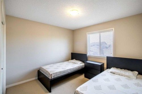 15 Kingsland Way Se, Airdrie, AB - Indoor Photo Showing Bedroom
