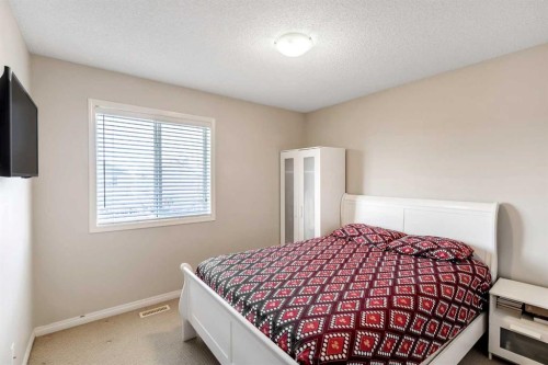 15 Kingsland Way Se, Airdrie, AB - Indoor Photo Showing Bedroom
