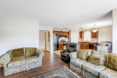 15 Kingsland Way Se, Airdrie, AB - Indoor Photo Showing Living Room