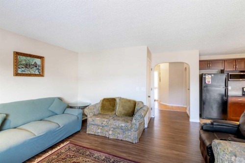 15 Kingsland Way Se, Airdrie, AB - Indoor Photo Showing Living Room