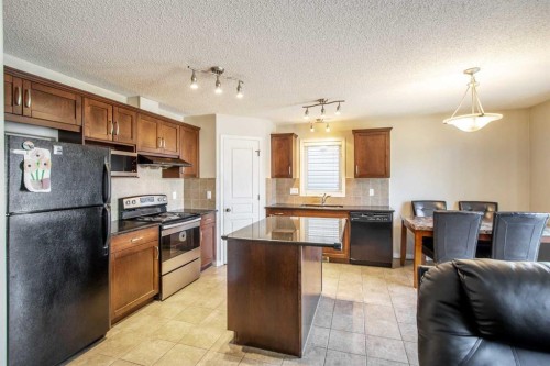 15 Kingsland Way Se, Airdrie, AB - Indoor Photo Showing Kitchen