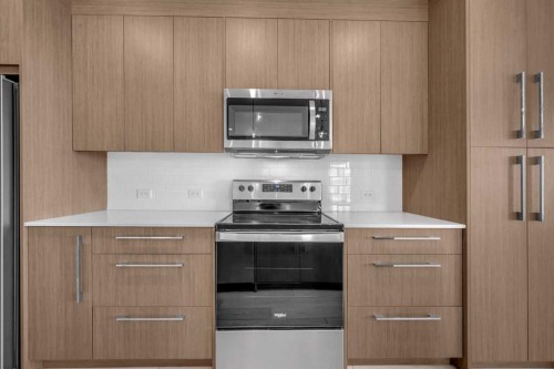 2301-681 Savanna Boulevard Ne, Calgary, AB - Indoor Photo Showing Kitchen