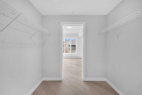 2301-681 Savanna Boulevard Ne, Calgary, AB - Indoor With Storage