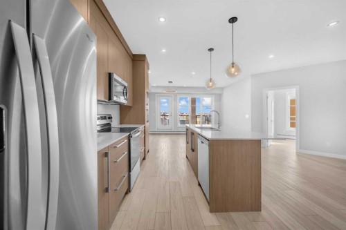 2301-681 Savanna Boulevard Ne, Calgary, AB - Indoor Photo Showing Kitchen With Upgraded Kitchen