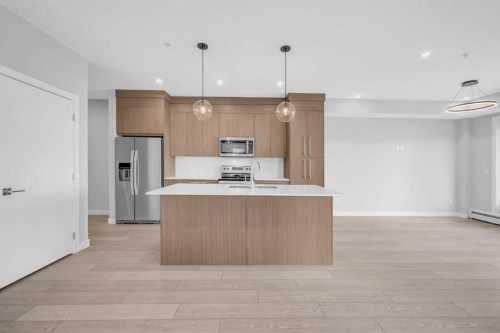 2301-681 Savanna Boulevard Ne, Calgary, AB - Indoor Photo Showing Kitchen With Upgraded Kitchen