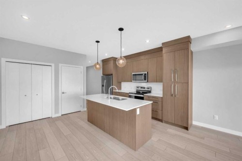 2301-681 Savanna Boulevard Ne, Calgary, AB - Indoor Photo Showing Kitchen With Upgraded Kitchen
