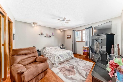 22 Glenhill Drive, Cochrane, AB - Indoor Photo Showing Bedroom