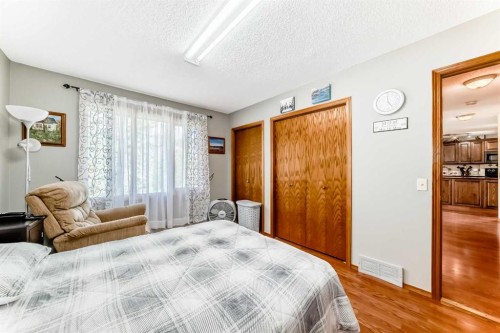 22 Glenhill Drive, Cochrane, AB - Indoor Photo Showing Bedroom