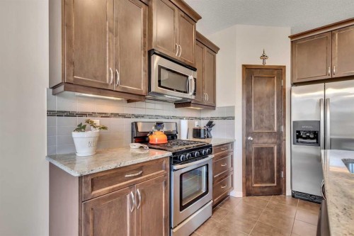 1544 Panatella Boulevard Nw, Calgary, AB - Indoor Photo Showing Kitchen With Stainless Steel Kitchen