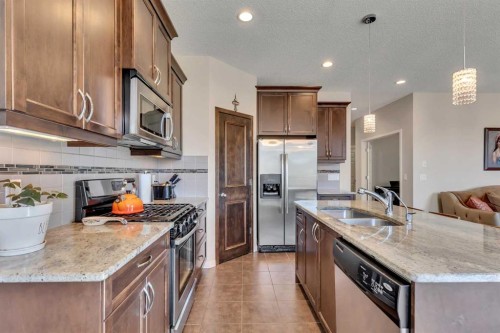 1544 Panatella Boulevard Nw, Calgary, AB - Indoor Photo Showing Kitchen With Stainless Steel Kitchen With Double Sink With Upgraded Kitchen
