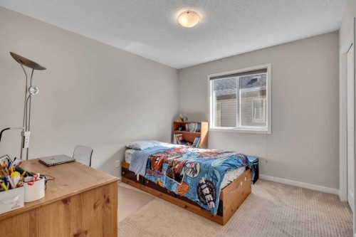 1544 Panatella Boulevard Nw, Calgary, AB - Indoor Photo Showing Bedroom